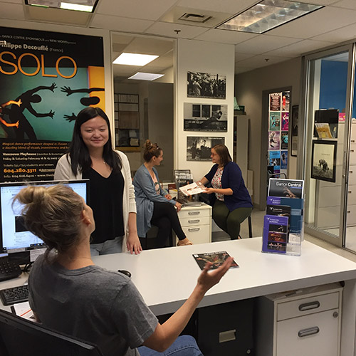 Dance Centre staff members talk in office at Scotiabank Dance Centre