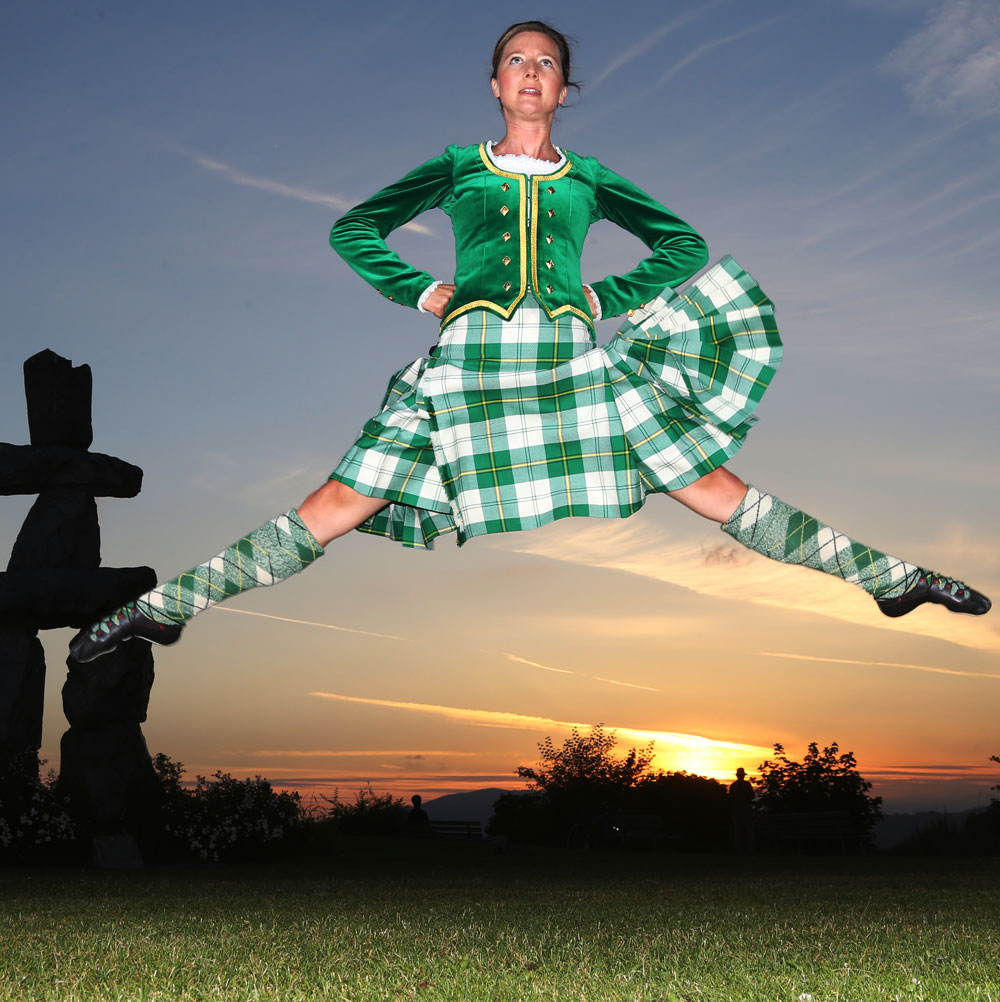 Dancer from Shot of Scotch jumps high in the air
